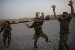 Afghan National Army soldiers play catch at Combat Outpost Terra Nova, in Kandahar, Afghanistan, Sunday, July 18, 2010. (AP Photo/Rodrigo Abd)